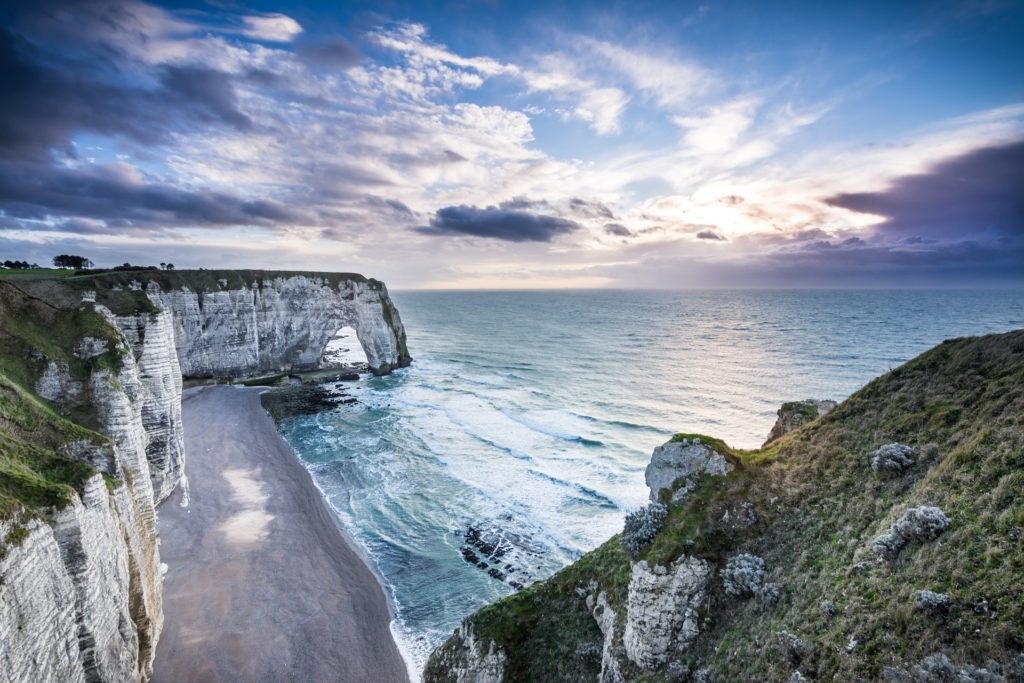 Etretat-Main-1024×683 a large waterfall over a body of water