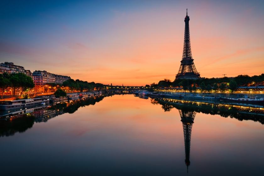 Paris-Fotolia_91574799_S a train crossing a bridge over a body of water