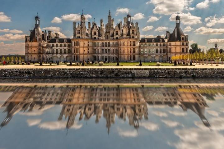 a castle with water in the background